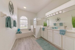 Combined shower/tub, hair dryer, towels, shampoo