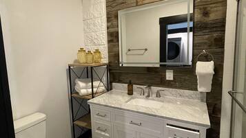 Shower, hair dryer, towels