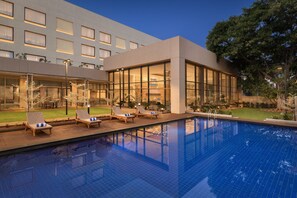 Outdoor pool, open 6:30 AM to 7:00 PM, pool umbrellas, pool loungers