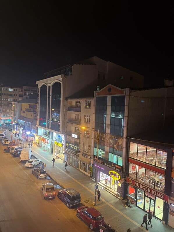Experience the vibrant city center, surrounded by a mix of modern and traditional architecture, with a variety of shops and restaurants nearby.