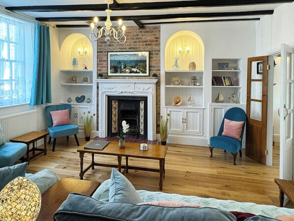 TV, fireplace, books