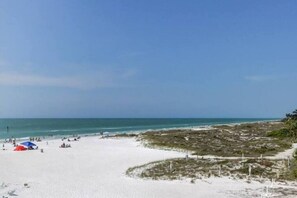 On the beach, sun loungers, beach towels