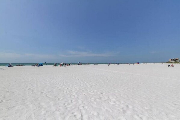 On the beach, sun loungers, beach towels