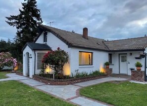 Charming single-story home with a pitched roof and cozy porch.