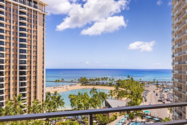 A high-rise hotel overlooking a beach with a clear view of the ocean and a pool area. - 1016 · Ilikai Collection # 4. Amazing views, beachfront. (Honolulu)