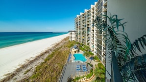 A beachfront hotel with a swimming pool, beach access, and a view of the ocean. - Beach Blessings Edgewater 0602T2 Beautiful condo with Beautiful views! (Panama City Beach)