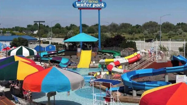 A water park with a sign reading "Roaring Springs Water Park". - Convenient 3-Bedroom Townhome with Full Garage (Nampa)