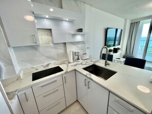 Fridge, microwave, stovetop, coffee/tea maker
