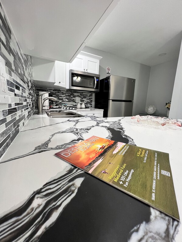 Fridge, microwave, stovetop, coffee/tea maker