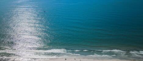 On the beach, sun-loungers, beach towels