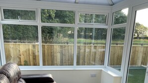 A conservatory with a view of a wooden fence and greenery. - 3 bedroom accommodation in Fraisthorpe, near Bridlington (Fraisthorpe, near Bridlington)