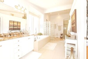 Combined shower/tub, hair dryer, towels, soap