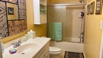 Combined shower/bathtub, towels, soap, toilet paper