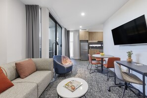 Superior One Bedroom Apartment | Living area | TV - Punthill Essendon North (Essendon)