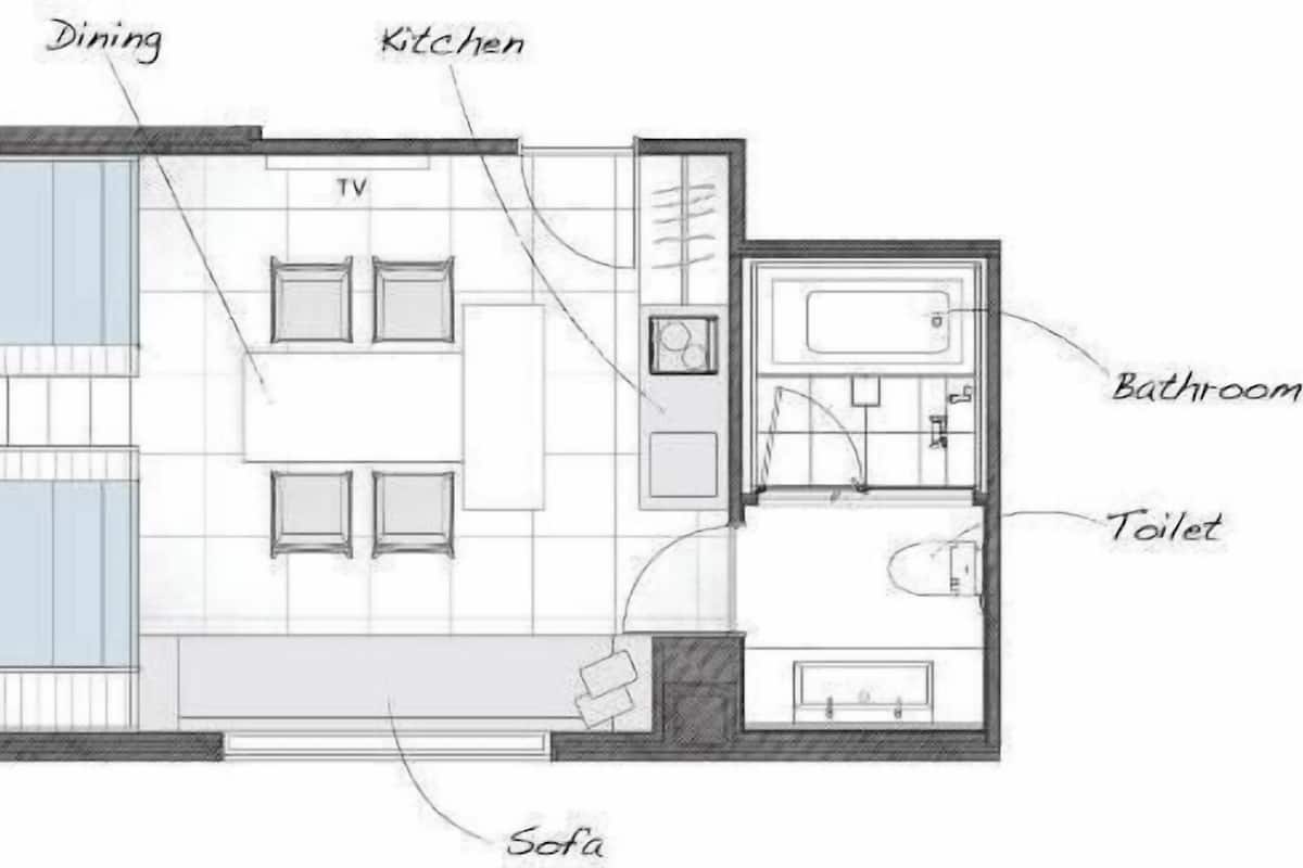 A floor plan with labeled areas including a dining area, kitchen, loft beds, TV, sofa, bathroom, and toilet.