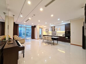 Family Apartment | Living area | 47-inch Smart TV with cable channels, TV - Vinhome Central Park Canh Apartment (Ho Chi Minh City)