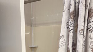 A shower with a glass door and a curtain featuring Parisian motifs. - Private, Clean and Charming at amazing rate (Manchester)
