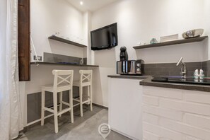 Fridge, microwave, stovetop, coffee/tea maker