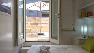 1 bedroom, desk, iron/ironing board, travel crib