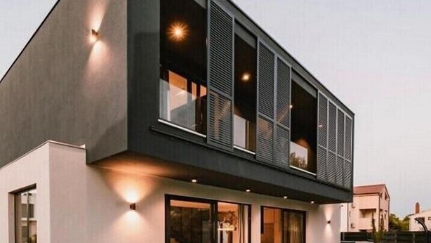 A modern two-story house with a swimming pool, large windows, and outdoor seating. - Luxury Villa Hera in Vodice (Srima)