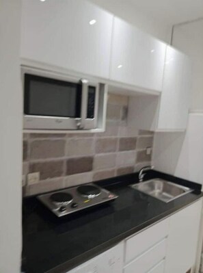 Fridge, microwave, stovetop, coffee/tea maker