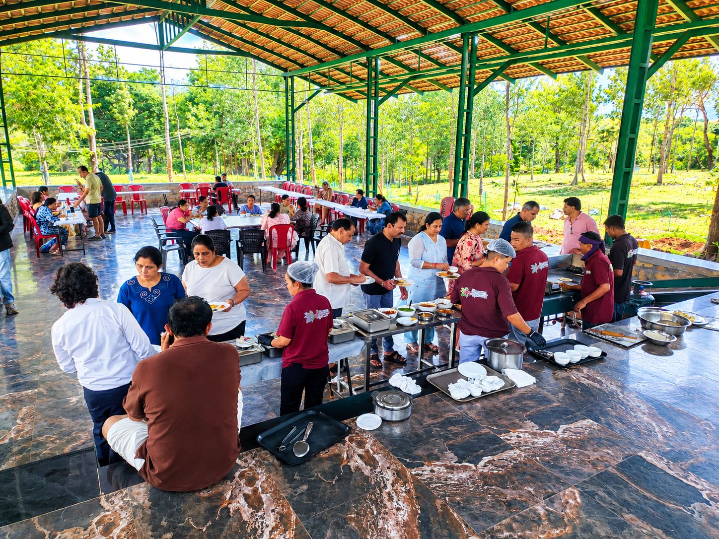An outdoor dining area with a covered pavilion, tables, and people dining.
