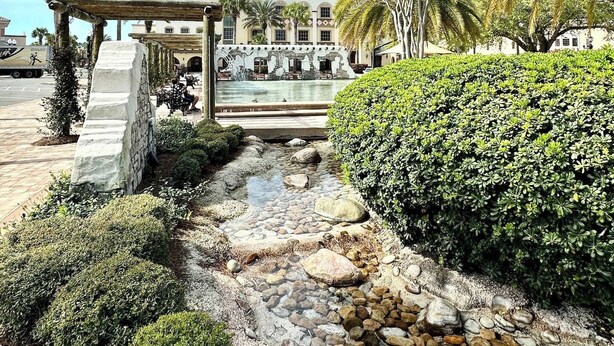 A courtyard with a stone pathway, a pergola, and a pool area. - 3/2 w/ Golf Cart in The Village of Santiago with Golf Course View! (The Villages)
