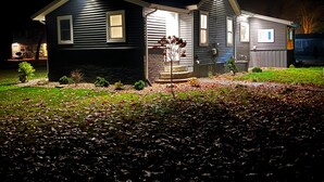 A two-story house with a sloped roof and a front porch. - 3- Bedroom Bungalow 20 Minutes From ND Campus (Elkhart)
