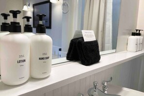 Bathtub, hair dryer, towels