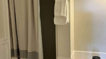 Bathtub, hair dryer, towels