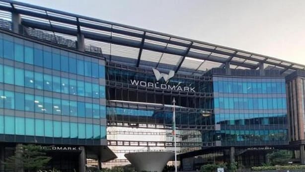 A modern building with a large glass facade and the "WORLDMARK" sign. - Hotel J. Palace (New Delhi)