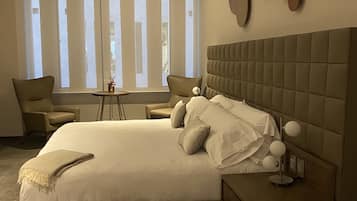 Suite Deluxe | 1 habitación, ropa de cama de alta calidad y edredón