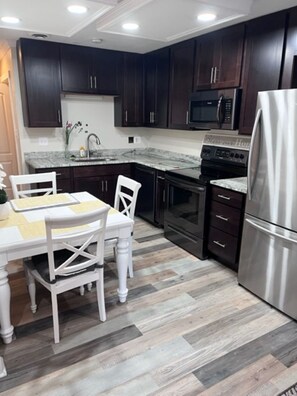 Fridge, microwave, oven, cookware/dishes/utensils