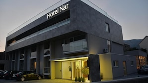 A modern hotel building with a prominent sign reading "Hotel Nar". - Nar Hotel (Trebinje)