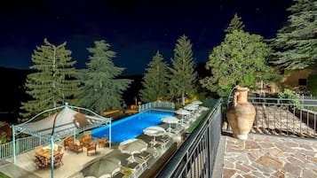 An infinity pool, pool loungers