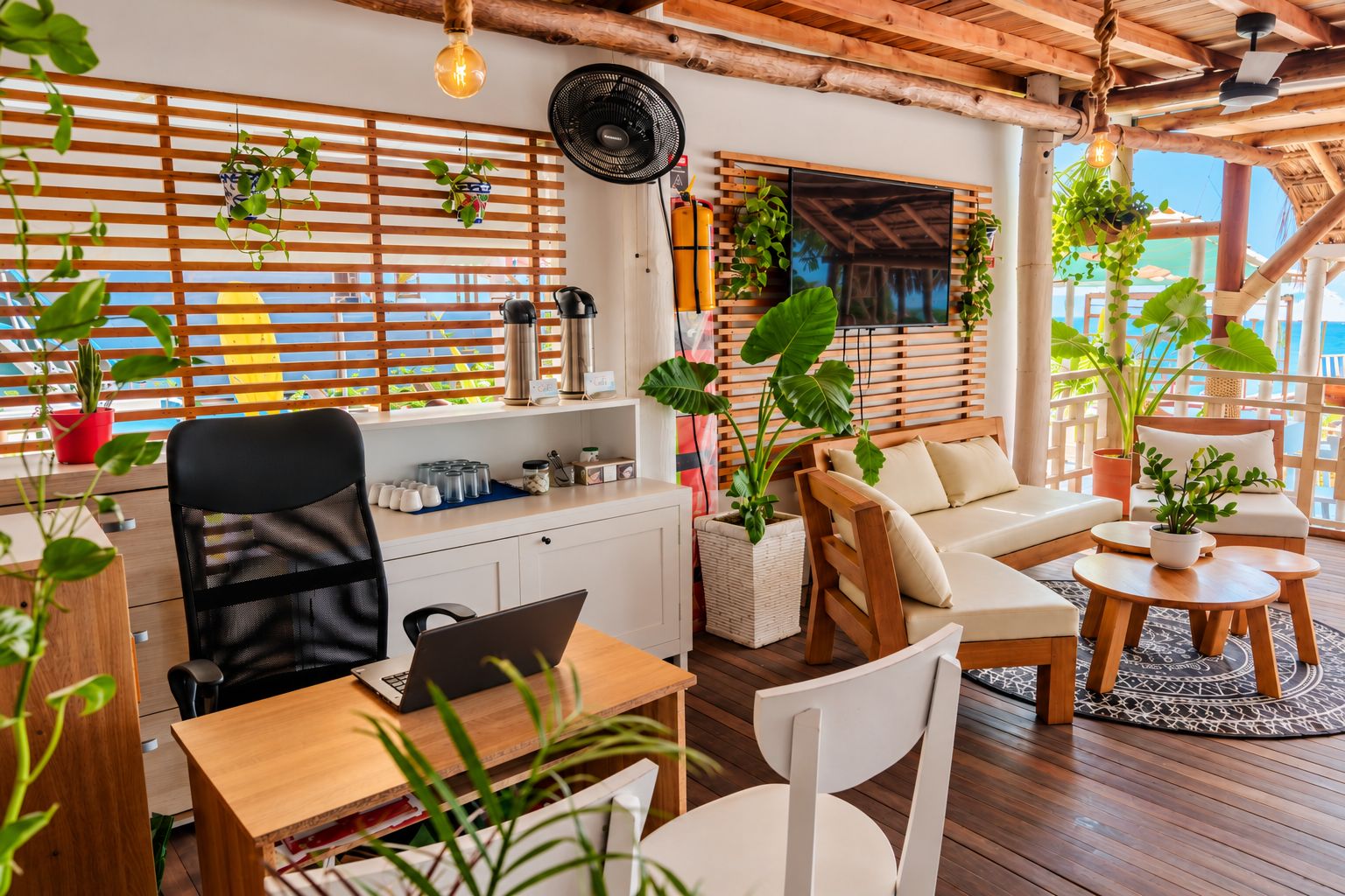 A modern living room with a wooden ceiling, a sofa, a dining table, and a TV mounted on a wooden wall.