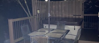 2 BR, 1-1/2 bath house in wooded setting with private back yard, deck, hot tub.