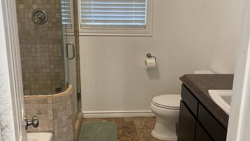 Bathtub, towels, toilet paper