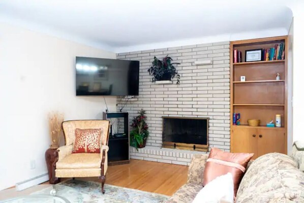 Smart TV, fireplace, books