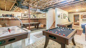 A room with a pool table, a foosball table, and a dartboard. - Welcome to the "Quay" Finger Lakes (Hammondsport)