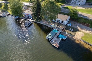 Guests can enjoy waterfront views from the dock and a nearby guest house.