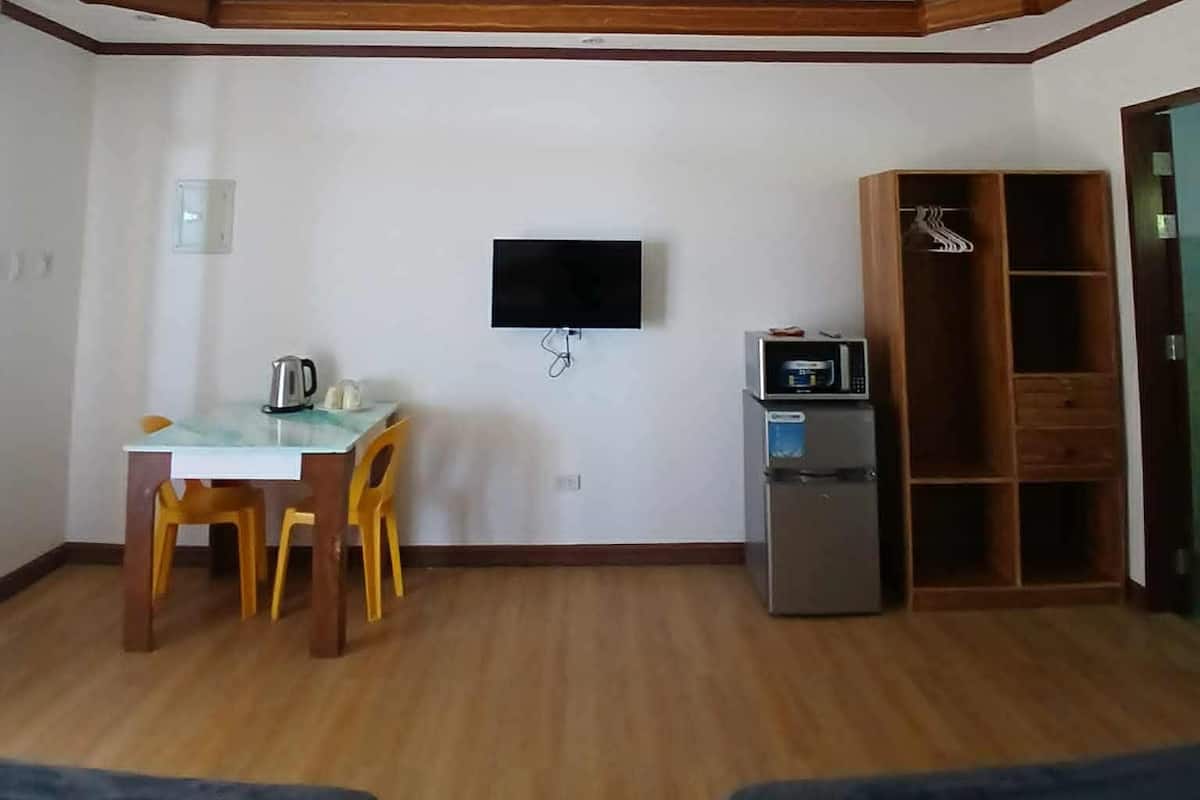 Mini-fridge, microwave, electric kettle, dining tables