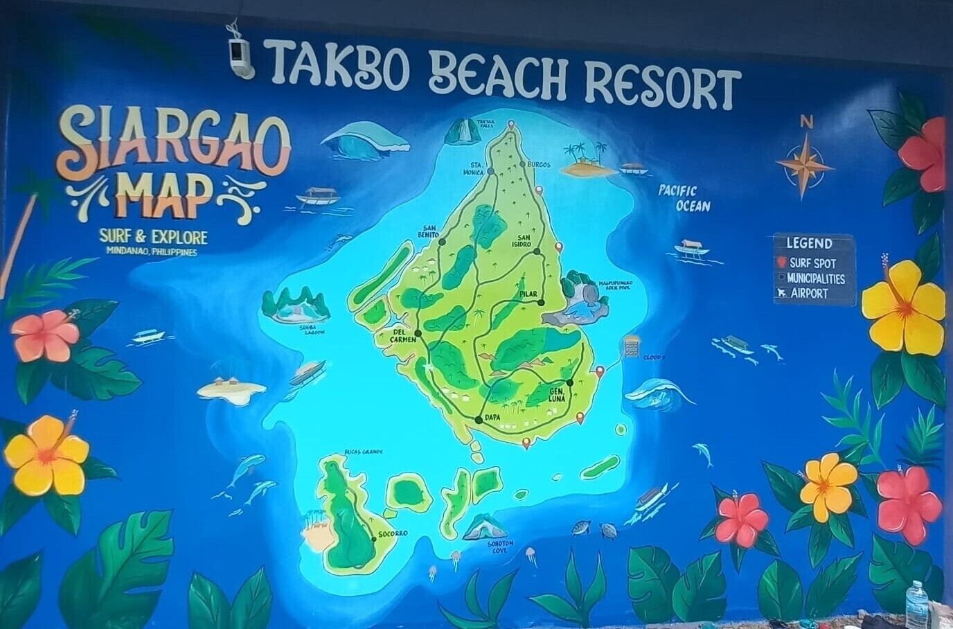 A map of Siargao Island with Takbo Beach Resort highlighted, featuring a surf spot, municipalities, and an airport.