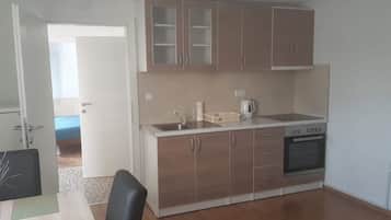 Apartment, 1 Queen Bed | Private kitchen | Fridge, microwave, oven, stovetop