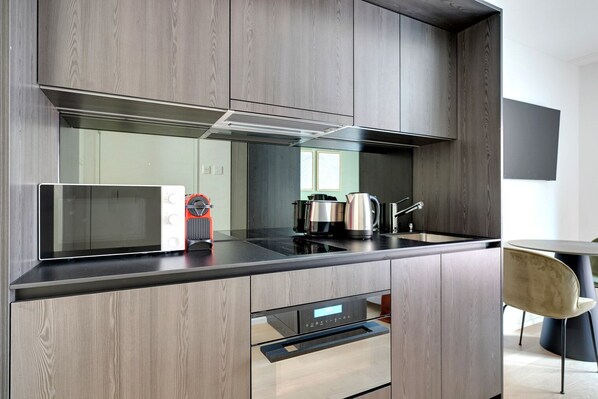 Fridge, microwave, oven, stovetop - Airy Wiedikon 1.5 Room w/ Storage & W/D, 1 min to Market, by Blueground (Zurich)