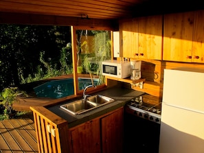 Panoramic Bungalow, 1 Bedroom, Pool Access, Ocean View | Private kitchen | Full-size fridge, microwave, oven, stovetop - Bounty Lodge (Arue)