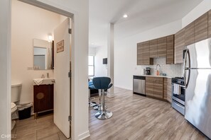 Room | Private kitchen | Fridge, oven, coffee/tea maker, toaster - Blue Line Beauty In The Heart Of Chicago - 747 Lofts Cabin 303 by RedAwning (Chicago)