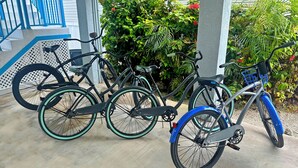 A covered outdoor area with three bicycles parked. - Relaxing Waterfront Escape Near Key West - Venture Out Unit 410 (Cudjoe Key)