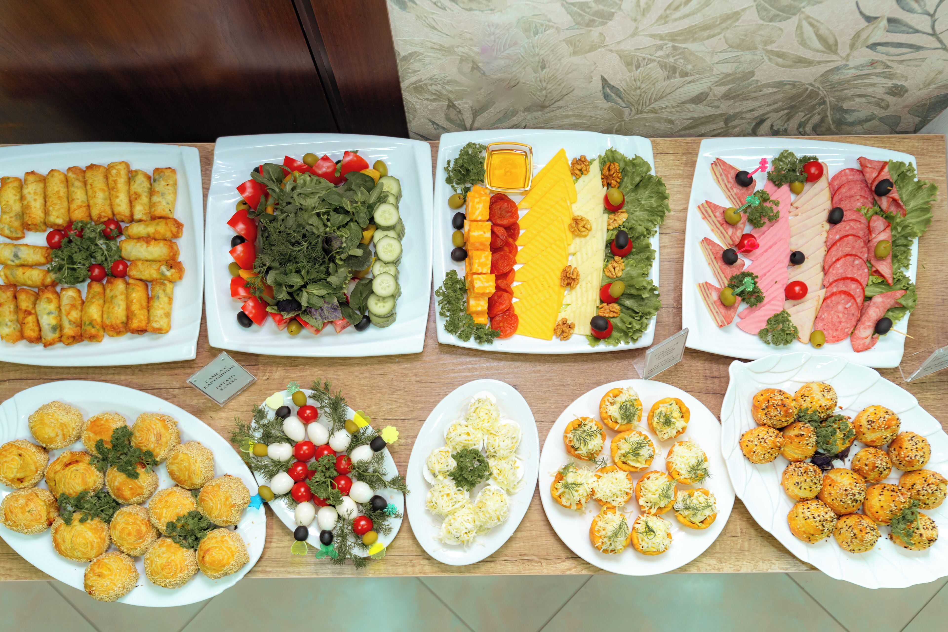 A variety of food platters on a table.