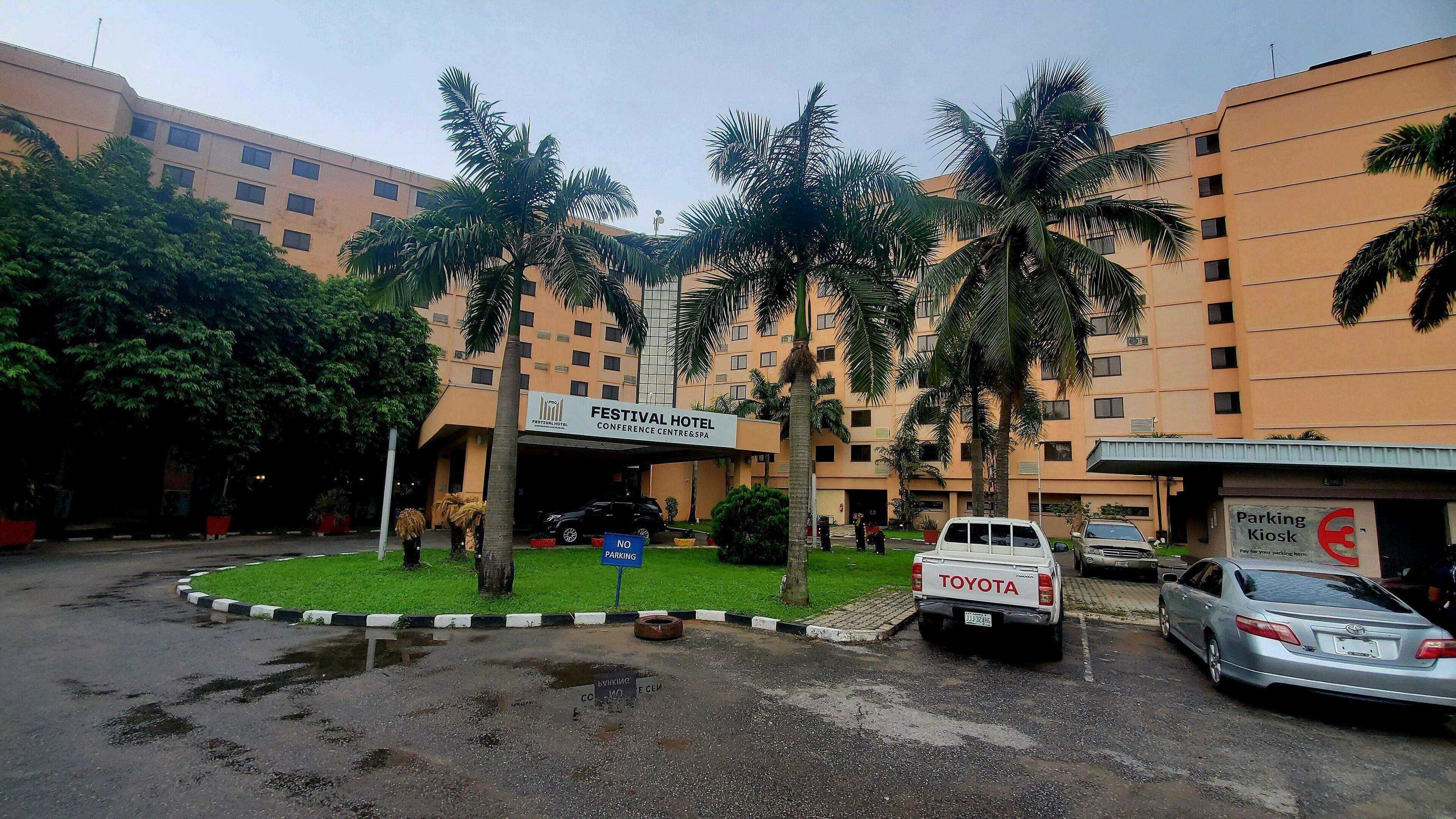 A multi-story building with a sign for the Festival Hotel Conference Centre & Spa.